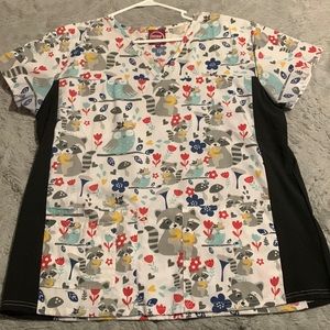 Pattern women’s scrub shirt, size XL the brand is Divine Scrubs by JDM.